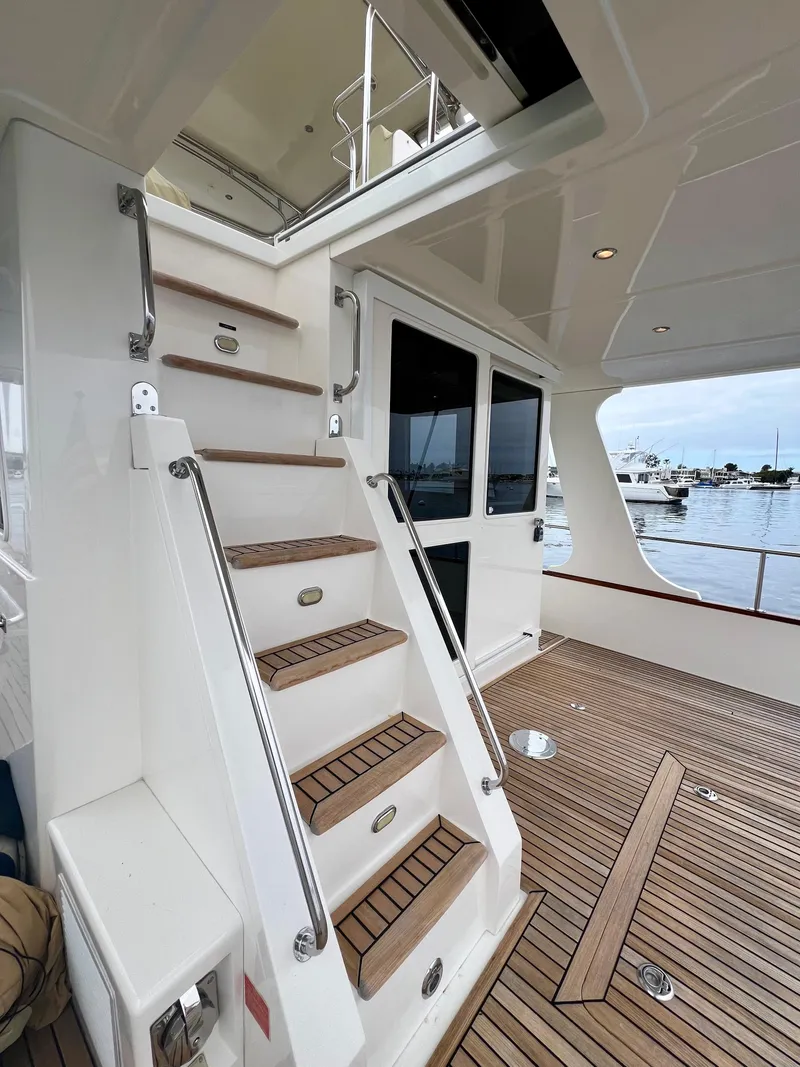 Slide: The Image of Staircase on 2008 Grand Banks 47 Heritage EU yacht with teak deck and marina view. - 41