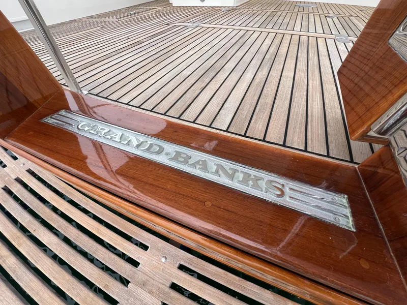 Slide: The Image of Grand Banks 47 Heritage EU 2008 yacht with polished wood deck and engraved nameplate. - 46