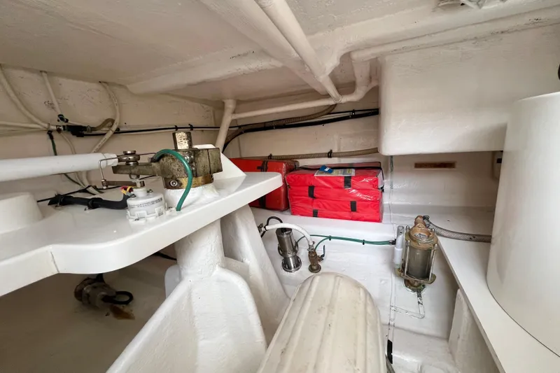 Slide: The Image of Engine room of 2008 Grand Banks 47 Heritage EU yacht, showcasing mechanical components and storage. - 76