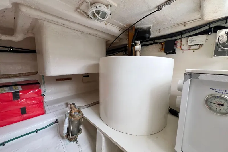 Slide: The Image of Engine room of 2008 Grand Banks 47 Heritage EU with equipment and storage. - 77