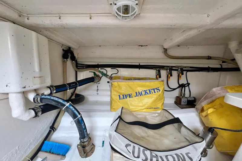 Slide: The Image of Storage compartment of 2008 Grand Banks 47 Heritage EU with life jackets and equipment. - 79