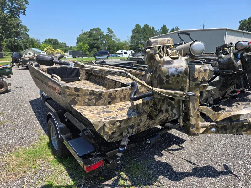 Slide: The Image of 2025 Excel 1754 F4 Shallow Water boat with camouflage design on a trailer. - 27