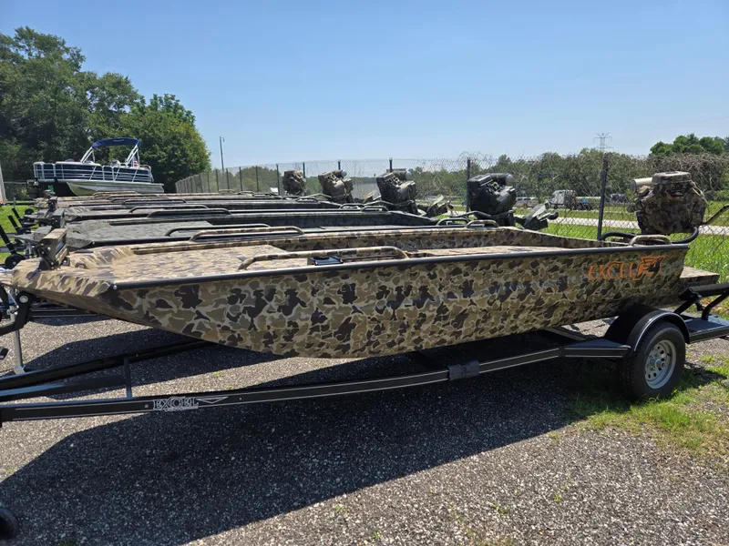 Slide: The Image of 2025 Excel 1754 F4 Shallow Water boat with camouflage design on a trailer. - 28