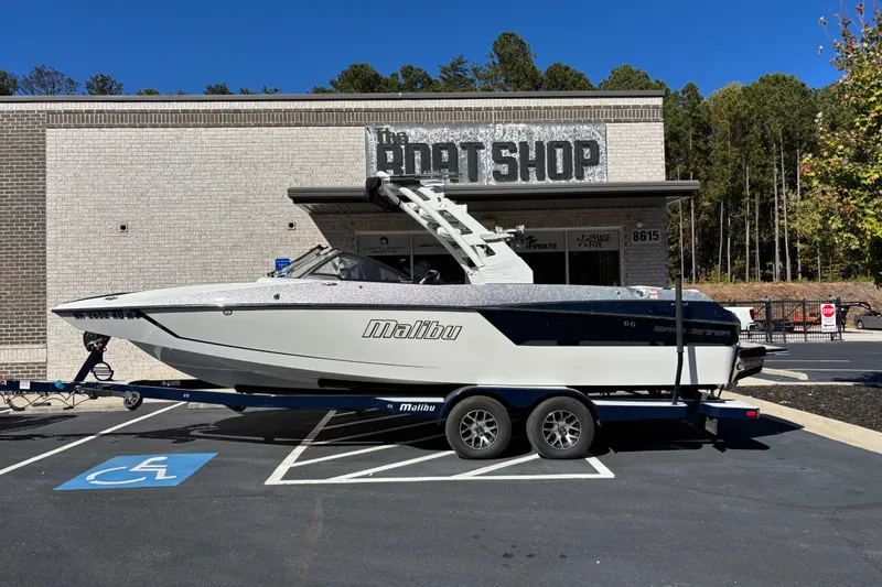 The Image of 2019 Malibu Wakesetter 24 MXZ boat on trailer outside The Boat Shop. - 0