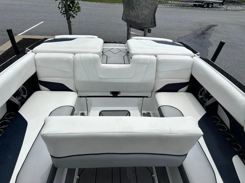 Slide: The Image of 2019 Malibu Wakesetter 24 MXZ interior with white seating and cup holders. - 10