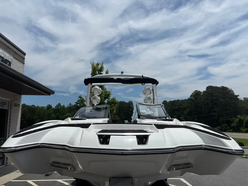 Slide: The Image of 2019 Malibu Wakesetter 24 MXZ boat on trailer in parking lot. - 3