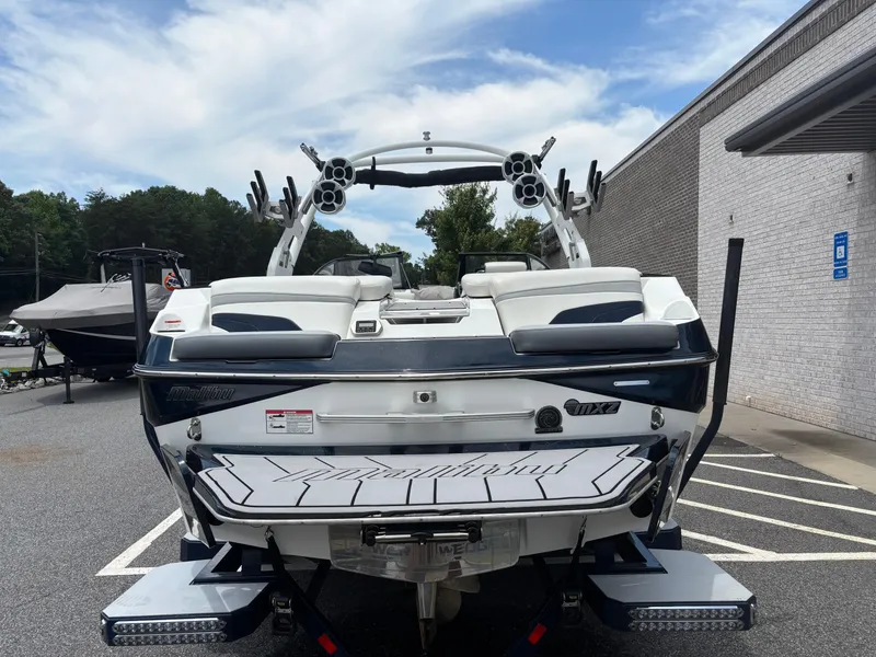 Slide: The Image of 2019 Malibu Wakesetter 24 MXZ boat, rear view, parked outdoors. - 5