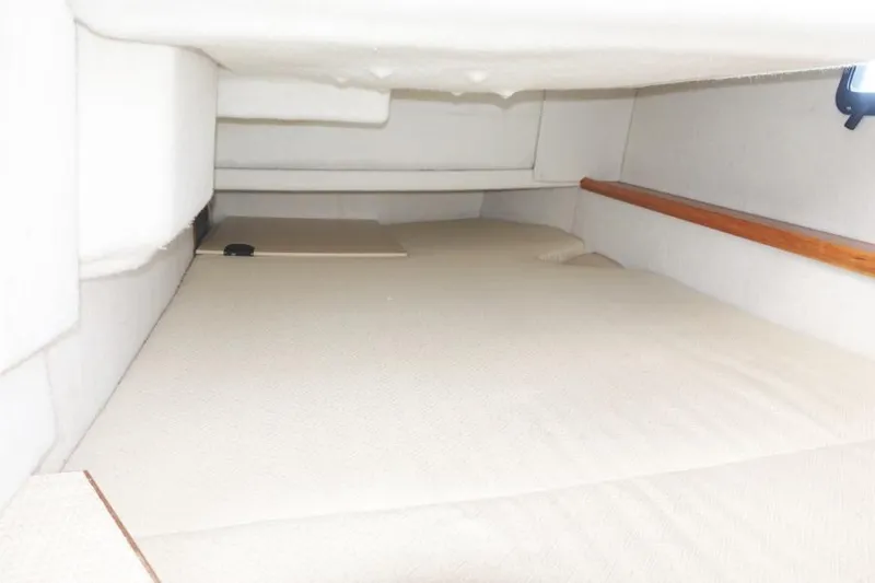 Slide: The Image of Interior cabin of 2015 Cutwater 30 Sedan LE, featuring a spacious sleeping area. - 20