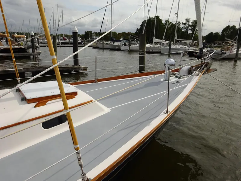 Slide: The Image of 1964 Hinckley Bermuda 40 Custom sailboat docked at a marina. - 14