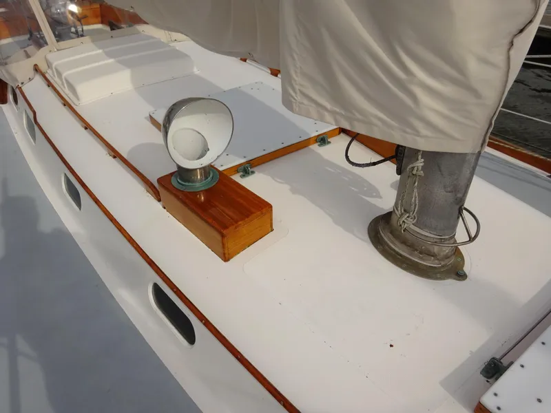 Slide: The Image of Hinckley Bermuda 40 Custom 1964 sailboat deck with wooden and metal fittings. - 16
