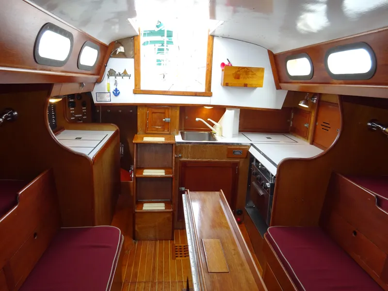 Slide: The Image of Interior of 1964 Hinckley Bermuda 40 Custom sailboat with wooden cabinetry and seating. - 35