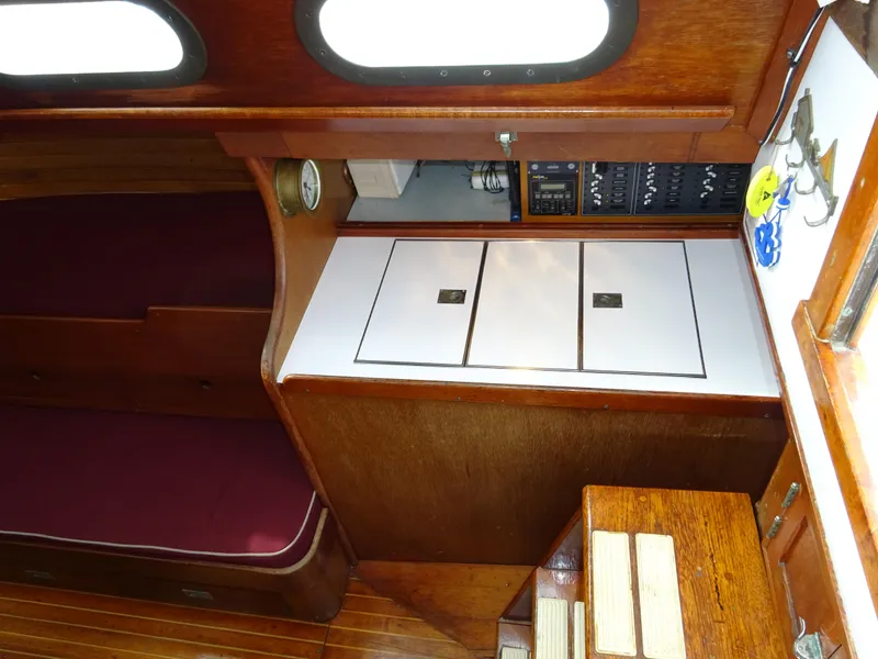 Slide: The Image of Interior of 1964 Hinckley Bermuda 40 Custom sailboat with wood finish and storage compartments. - 37