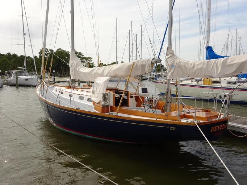 Slide: The Image of 1964 Hinckley Bermuda 40 Custom sailboat docked in a marina. - 7