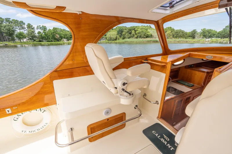 Slide: The Image of 1997 Hinckley Picnic Boat Classic interior with elegant wood finish and comfortable seating. - 28
