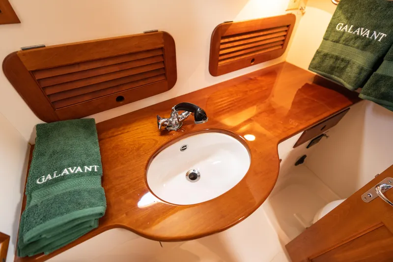 Slide: The Image of Elegant wooden vanity in 1997 Hinckley Picnic Boat Classic bathroom. - 43