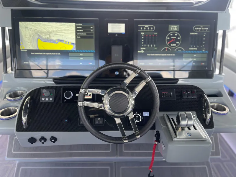 Slide: The Image of Cockpit of 2022 Mystic Powerboats M3800 with advanced navigation and control systems. - 10