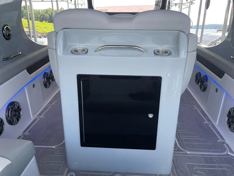 Slide: The Image of 2022 Mystic Powerboats M3800 interior with sleek seating and modern design elements. - 12