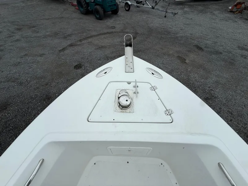 Slide: The Image of Bow of 2004 Sailfish 266 CC boat on gravel surface. - 9