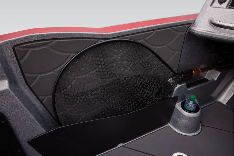 Slide: The Image of 2025 Nitro ZV20 Sport Pro boat interior with storage net and cup holder. - 20