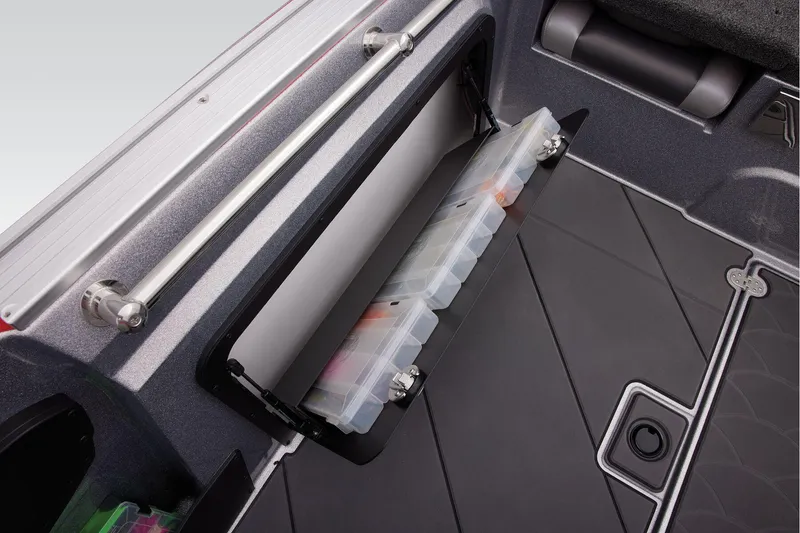 Slide: The Image of 2025 Nitro ZV20 Sport Pro boat storage compartment with organized tackle boxes. - 21