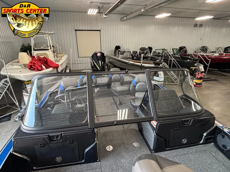 Slide: The Image of 2025 Nitro ZV20 Sport Pro boat in showroom, featuring sleek design and spacious seating. - 8