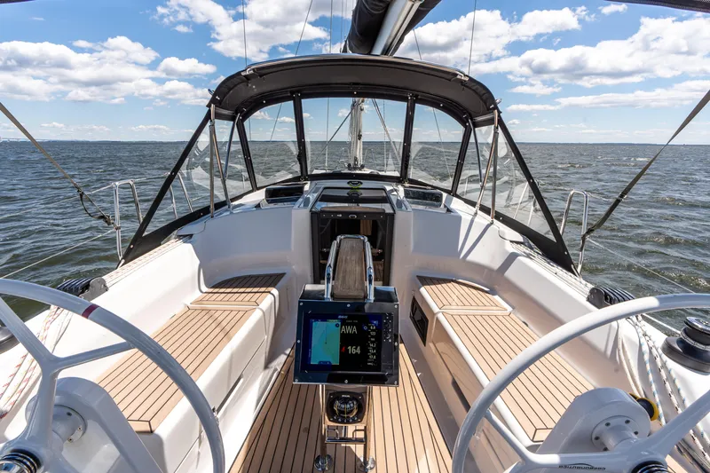 Slide: The Image of 2023 Hanse 348 sailboat cockpit with modern navigation system, sailing on open water. - 29