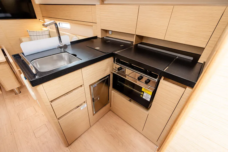 Slide: The Image of Modern kitchen in 2023 Hanse 348 yacht with sleek cabinetry and appliances. - 46