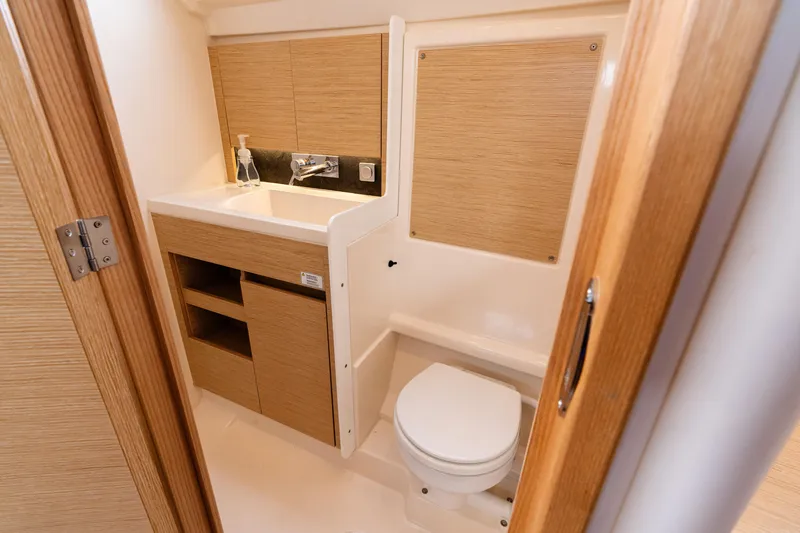Slide: The Image of Modern bathroom in 2023 Hanse 348 yacht with wooden cabinetry and compact design. - 49