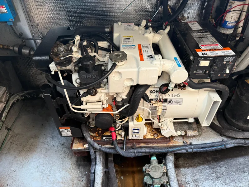 Slide: The Image of Engine room of a 2004 Sea Ray 290 Amberjack with Kohler generator. - 33