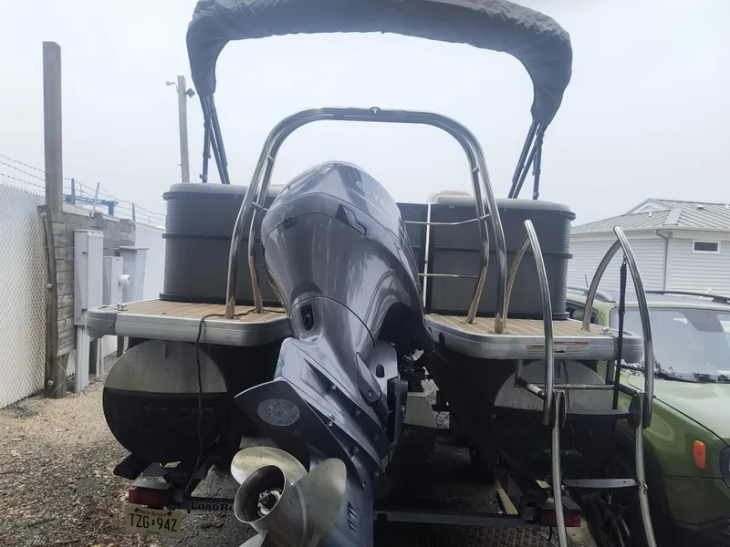 Slide: The Image of 2017 Godfrey Sweetwater Premium Edition 255 SBH pontoon boat with outboard motor, parked on trailer. - 3