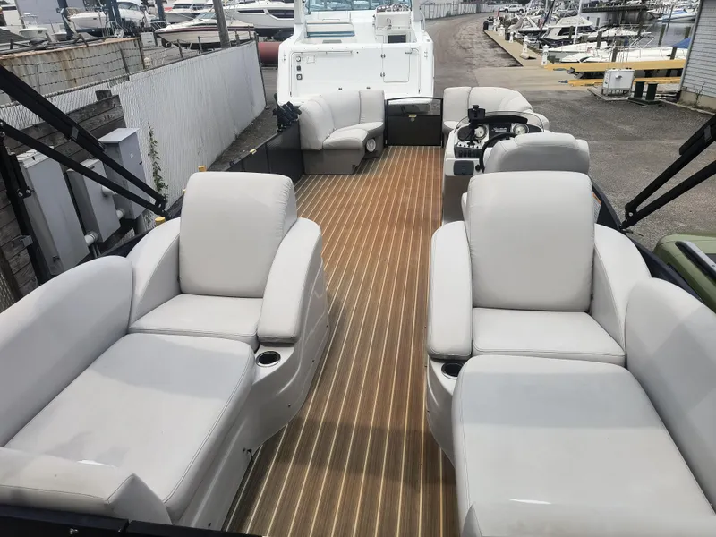 Slide: The Image of 2017 Godfrey Sweetwater Premium Edition 255 SBH pontoon boat with spacious seating and elegant design. - 4