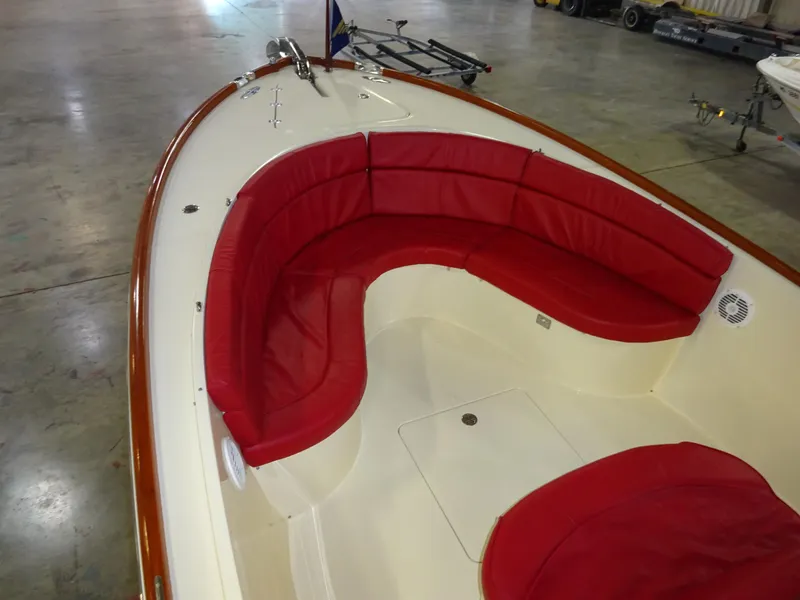 Slide: The Image of 2007 Hinckley T29C boat interior with red seating in a spacious cabin. - 18