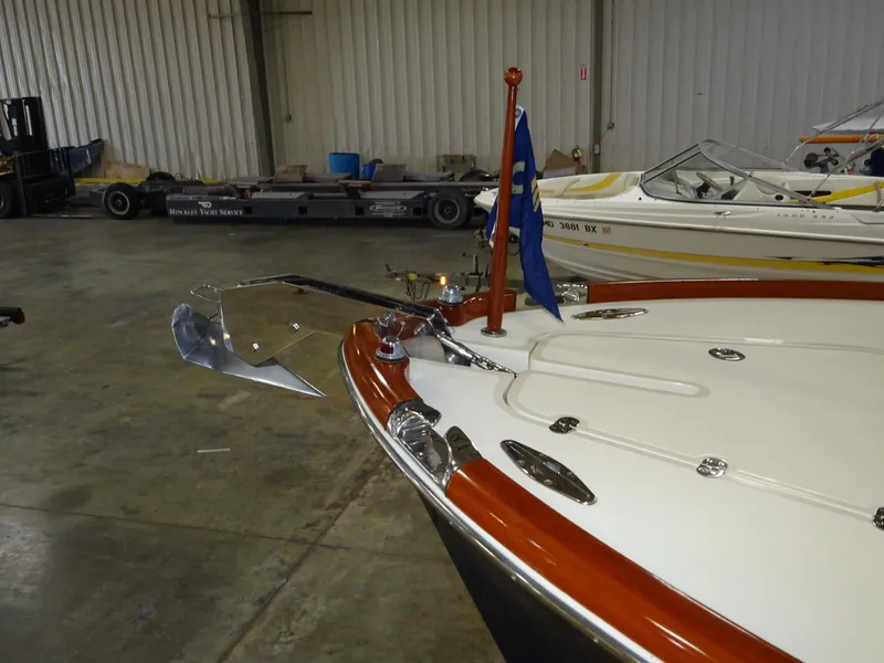 Slide: The Image of Hinckley T29C 2007 boat in a warehouse, featuring a polished anchor and flag. - 20
