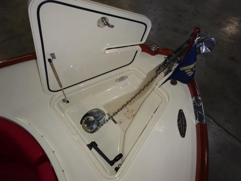 Slide: The Image of Anchor compartment of 2007 Hinckley T29C boat with chain and flag. - 21