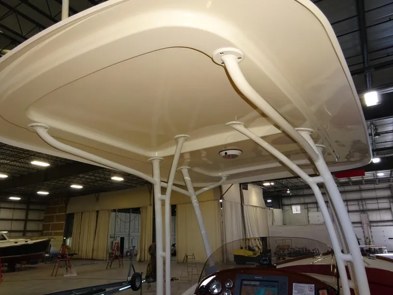 Slide: The Image of 2007 Hinckley T29C boat canopy in a warehouse setting. - 38