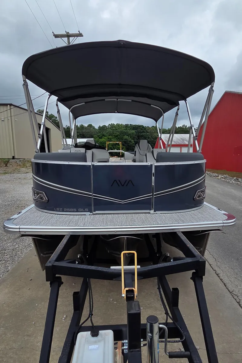 Slide: The Image of 2025 Avalon Platinum LSZ 2585 Quad Lounger Shift pontoon boat on trailer, rear view. - 3