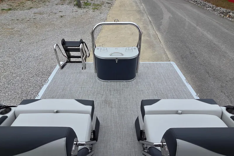 Slide: The Image of 2025 Avalon Platinum LSZ 2585 Quad Lounger Shift boat interior with seating and ladder. - 8