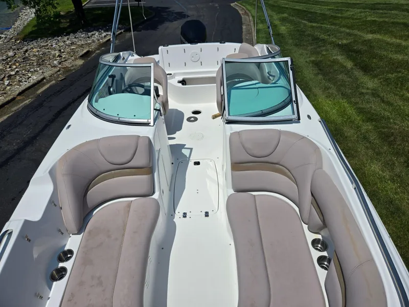 Slide: The Image of 2014 Hurricane SunDeck 2200 OB boat with spacious seating and open deck design. - 11