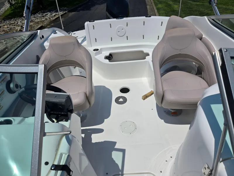Slide: The Image of 2014 Hurricane SunDeck 2200 OB interior with dual seating and steering console. - 12
