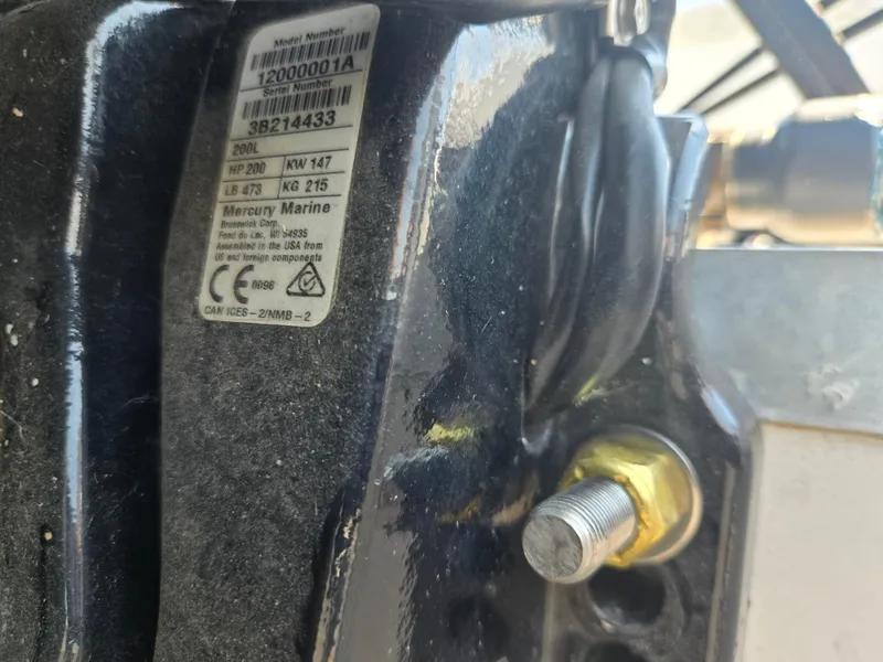 Slide: The Image of Close-up of a Mercury Marine engine part on a 2014 Hurricane SunDeck 2200 OB boat. - 24