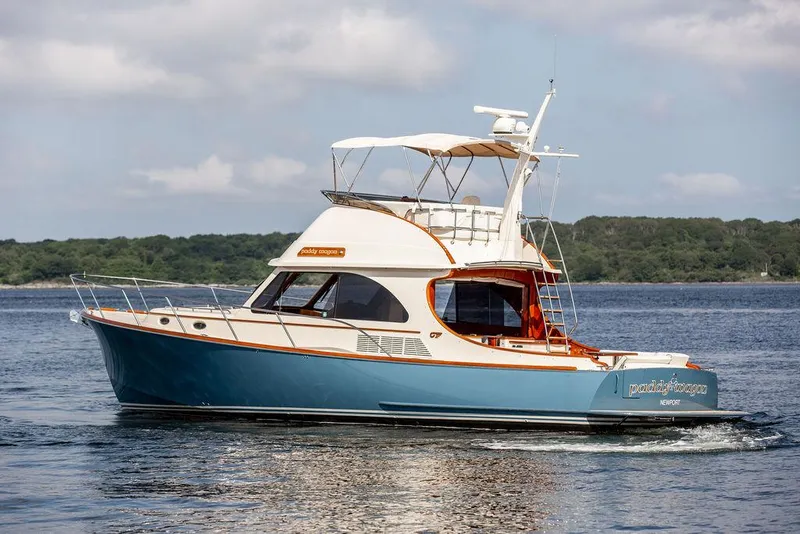 Slide: The Image of 2017 Hinckley Talaria 43 Flybridge yacht cruising on calm waters. - 1