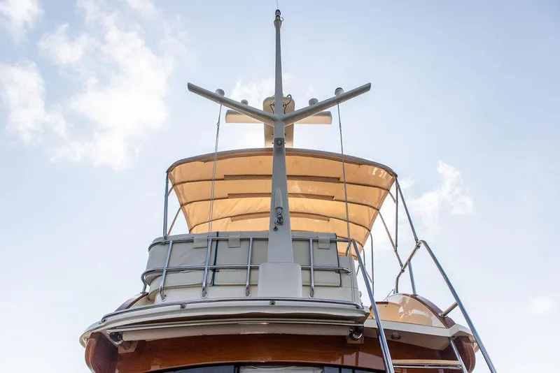 Slide: The Image of Hinckley Talaria 43 Flybridge 2017, view of flybridge and canopy against blue sky. - 11