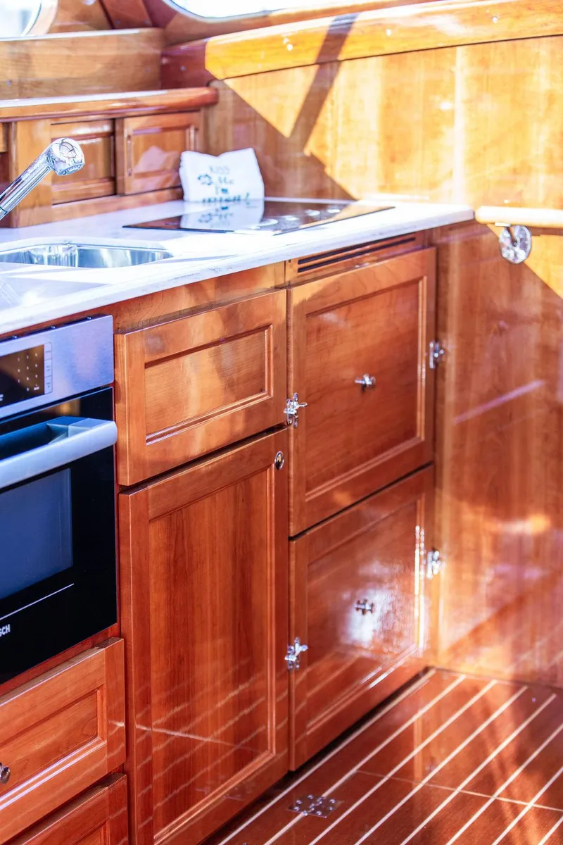 Slide: The Image of Luxurious wooden kitchen interior of 2017 Hinckley Talaria 43 Flybridge yacht. - 28