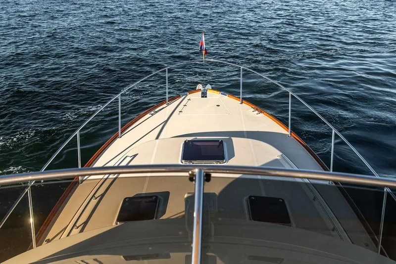 Slide: The Image of 2017 Hinckley Talaria 43 Flybridge cruising on open water, view from the flybridge. - 33