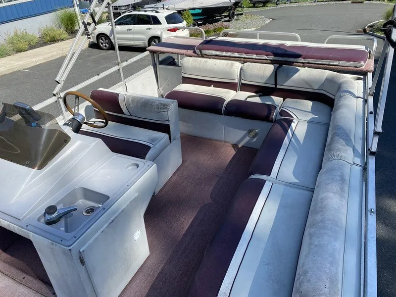 Slide: The Image of 1994 Sun Tracker Party Barge 24 pontoon boat with spacious seating and steering console. - 10