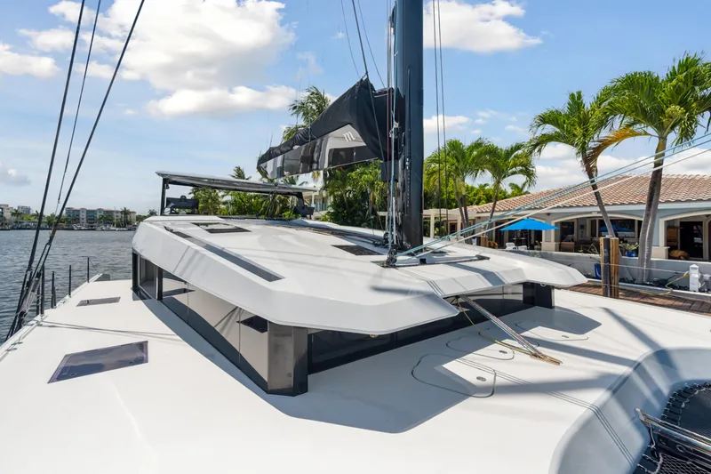 Slide: The Image of 2019 McConaghy MC60 yacht docked, showcasing sleek design and modern architecture. - 19