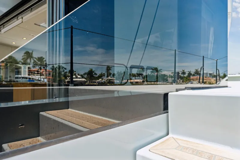 Slide: The Image of 2019 McConaghy MC60 yacht deck with sleek glass reflections and modern design elements. - 26