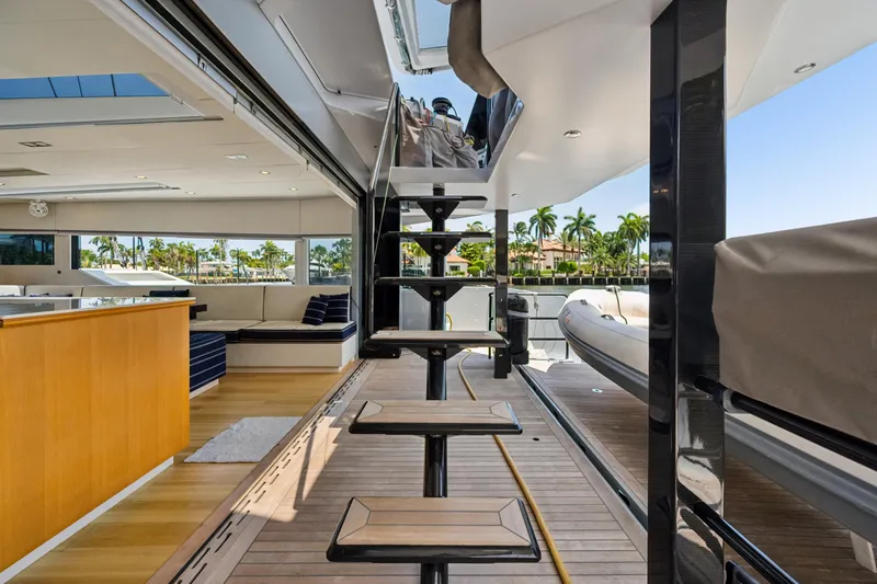 Slide: The Image of Luxurious interior of 2019 McConaghy MC60 yacht with modern staircase and seating area. - 27