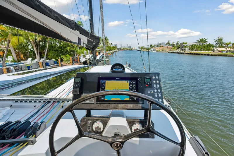 Slide: The Image of 2019 McConaghy MC60 yacht helm with navigation system, cruising on a scenic waterway. - 29