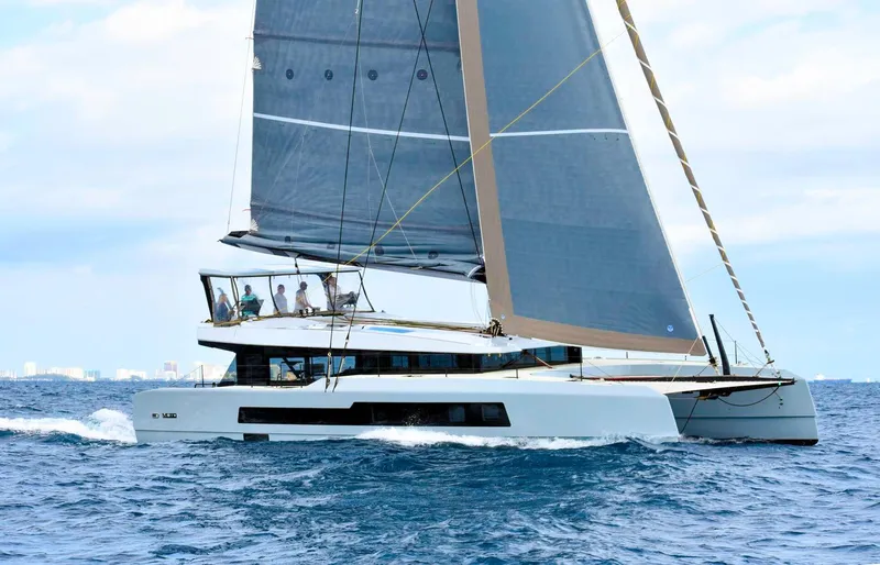 Slide: The Image of 2019 McConaghy MC60 yacht sailing on open sea with crew onboard. - 3